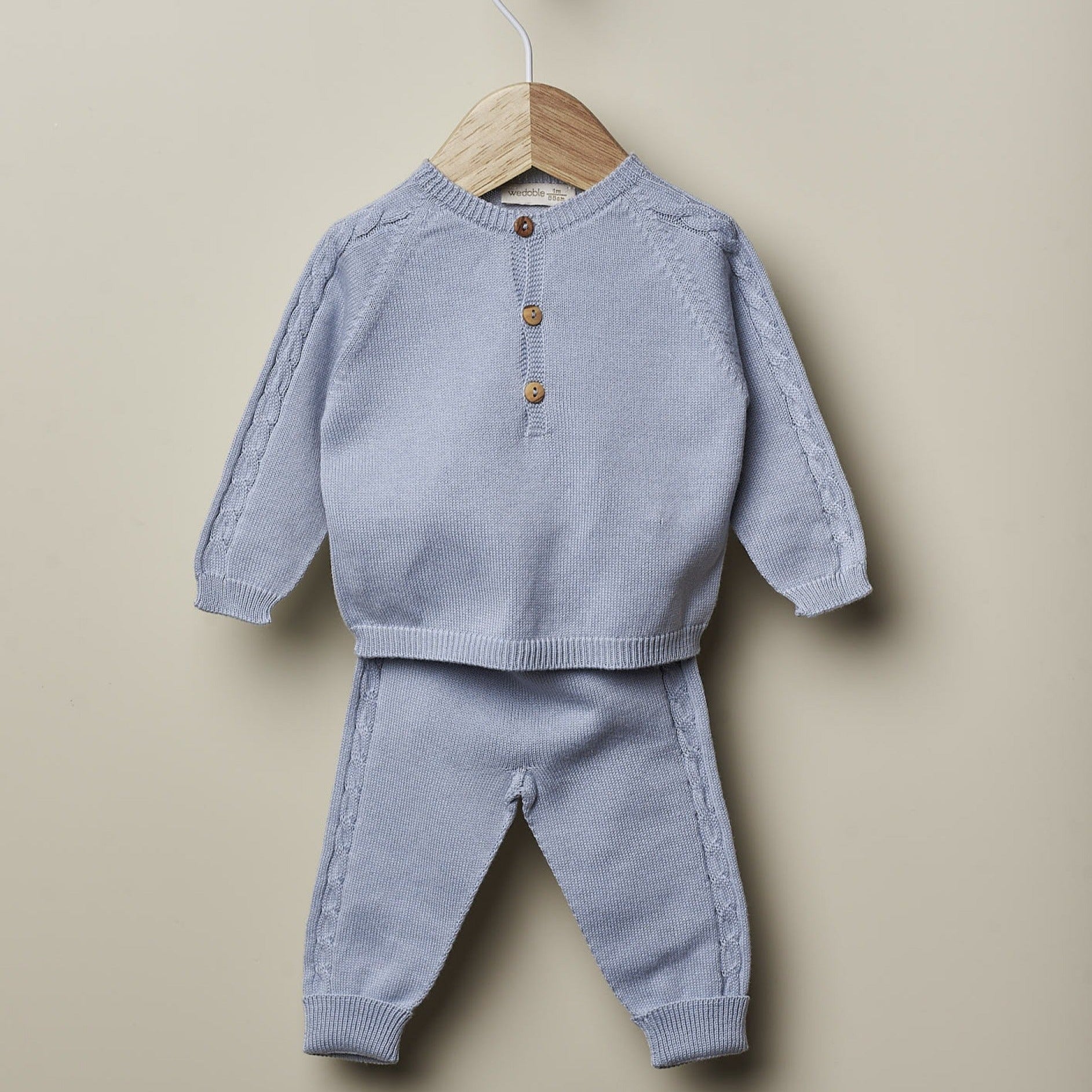 Completo nascita azzurro in cotone organico con trecce - Be Brave Boutique