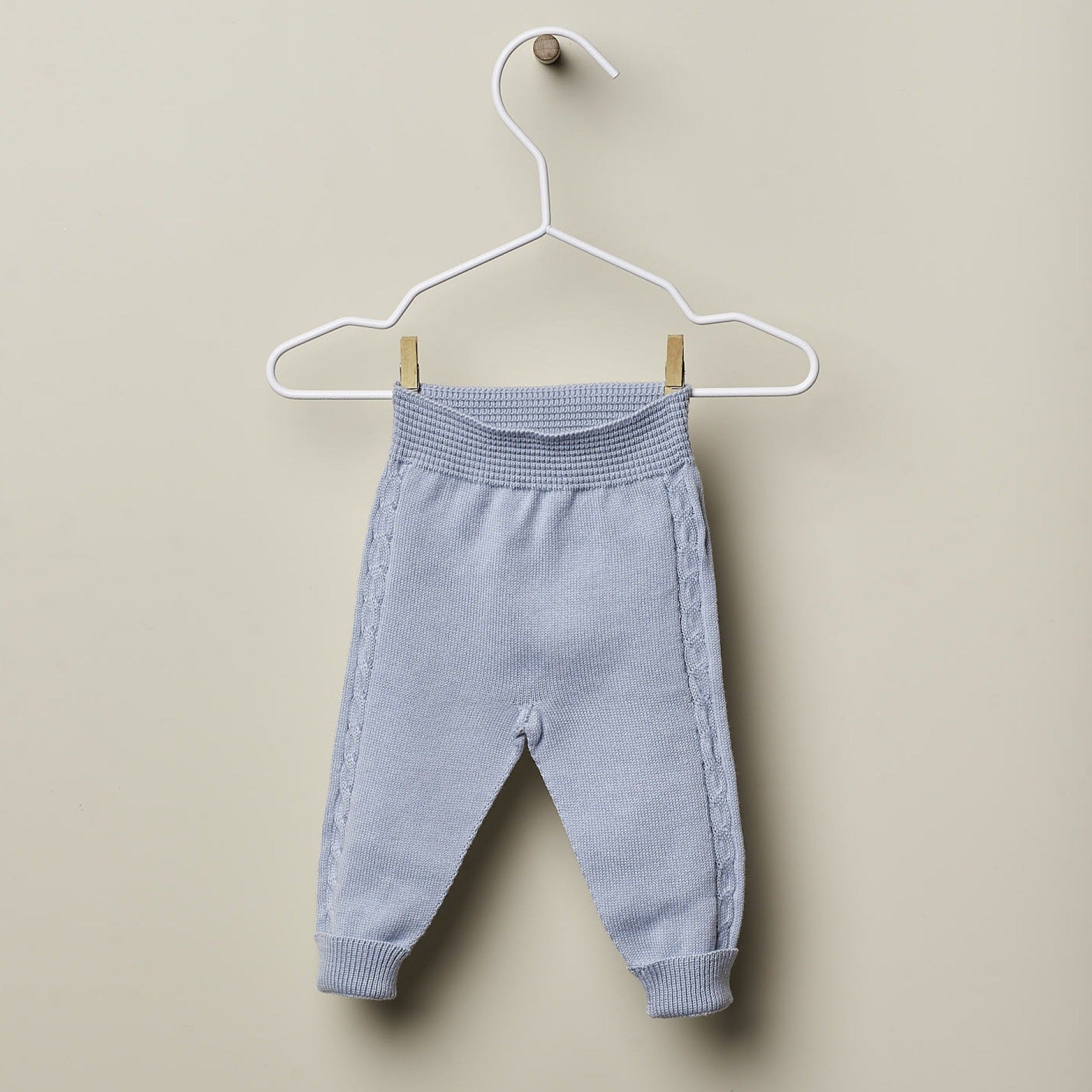 Completo nascita azzurro in cotone organico con trecce - Be Brave Boutique